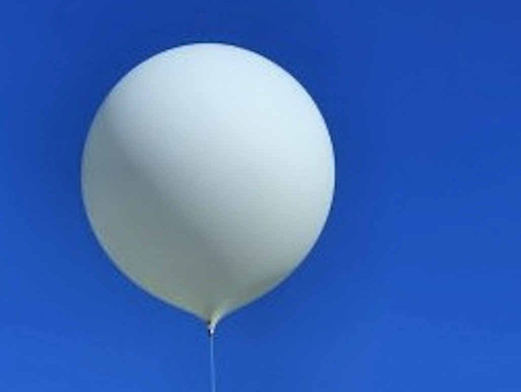 A weather balloon with radiosonde attached. A weather balloon with radiosonde attached.